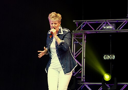 Hazell Dean performing on stage, one of Stock Aitken Waterman's earliest Hi-NRG acts